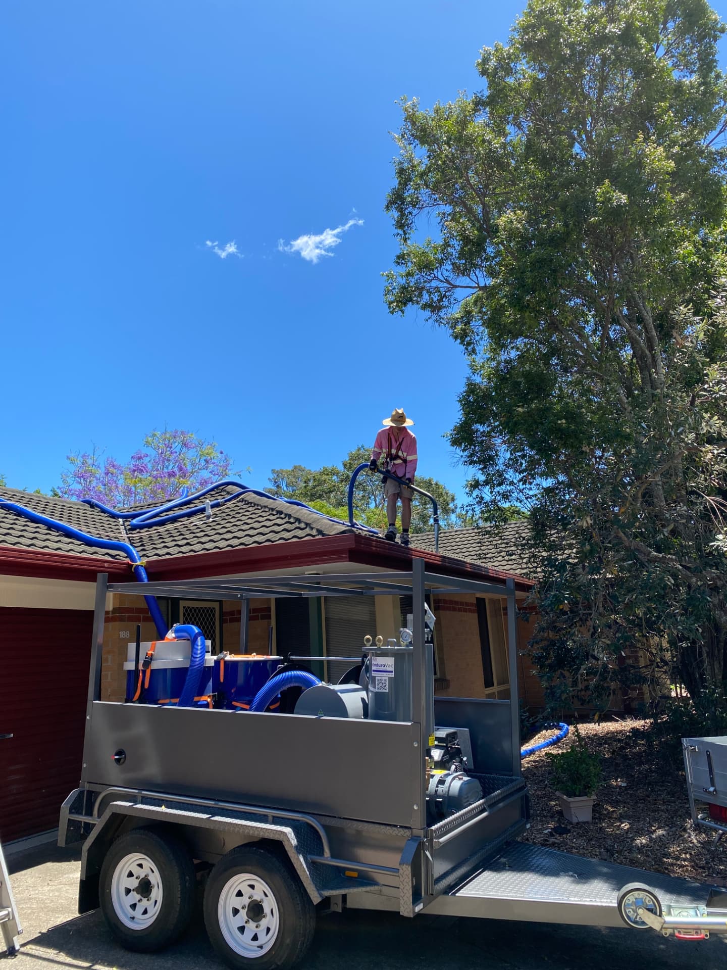 Professional gutter cleaning service on a Gold Coast home